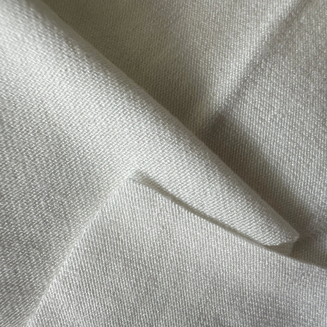 Buy aloe vera-infused spandex knitted fabric, highlighting its texture and subtle sheen.