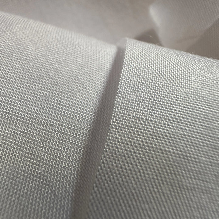 Lightweight banana plain fabric showing clean weave texture for eco-fashion production