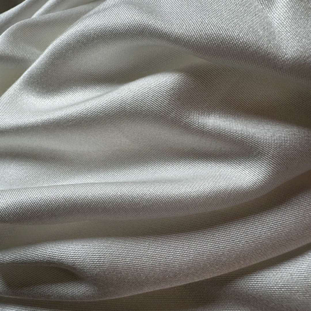 Close-up of banana satin weave showing elegant shine and sustainable texture