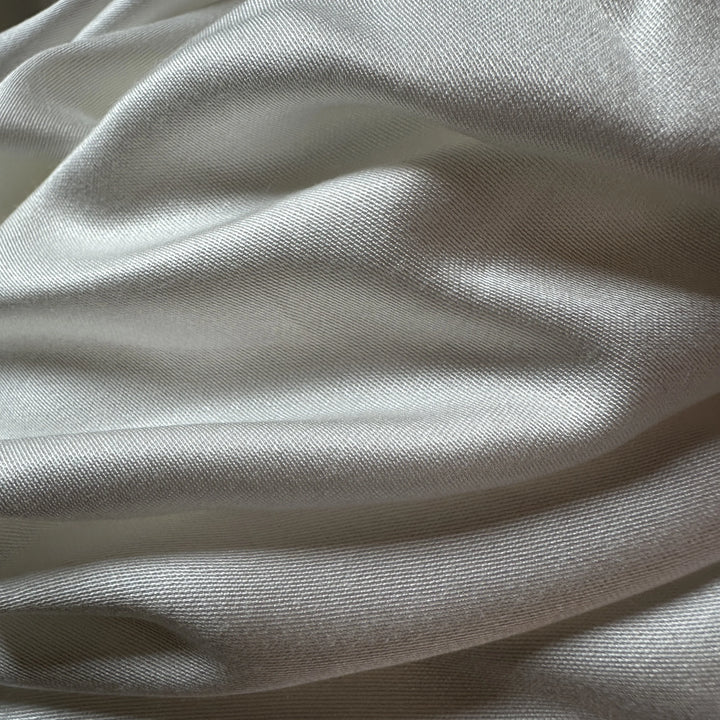 Close-up of banana satin weave showing elegant shine and sustainable texture