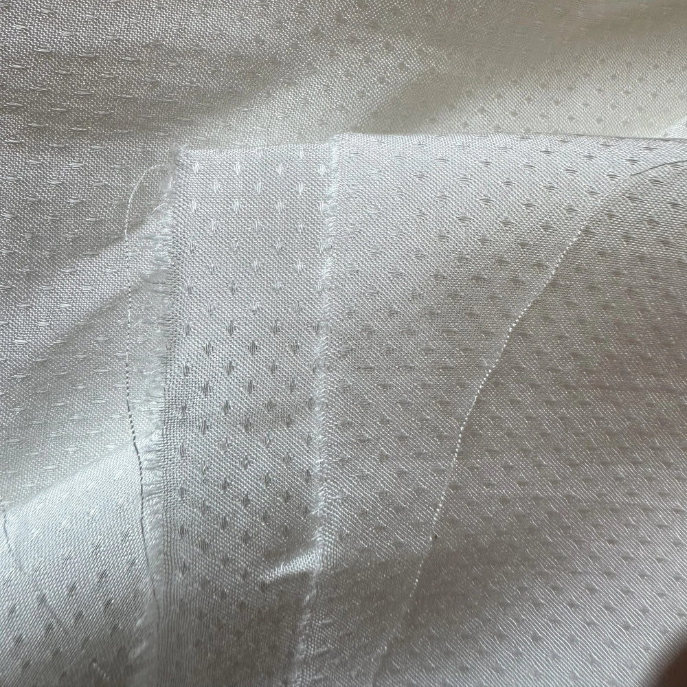 Soft banana fabric with intricate dotted dobby weave
