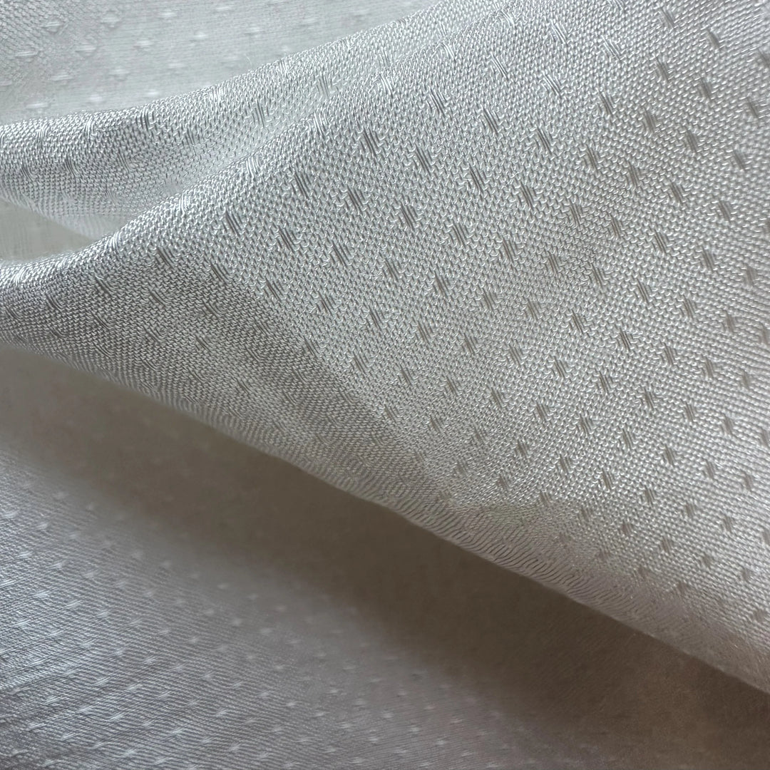 Natural banana textile with dotted dobby texture, ideal for eco-conscious clothing