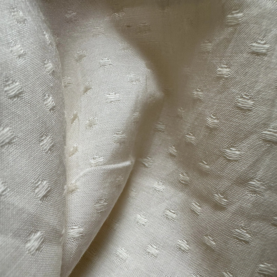 Organic banana fabric with intricate circle dobby weave for ethical fashion