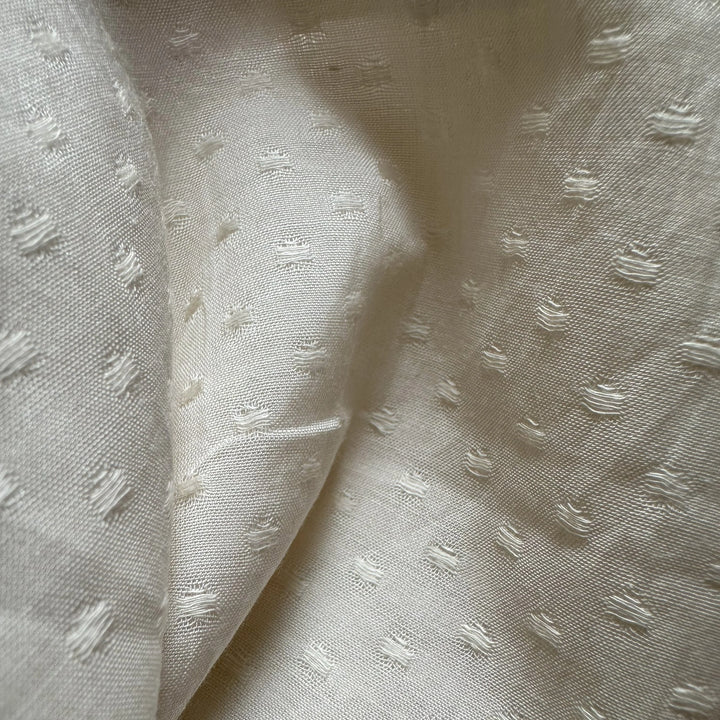 Organic banana fabric with intricate circle dobby weave for ethical fashion
