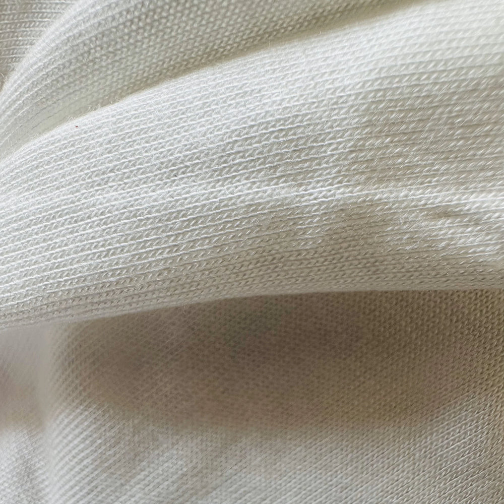 100% Banana Knitted Fabric used to make t-shirt, leggings, and a sports bra