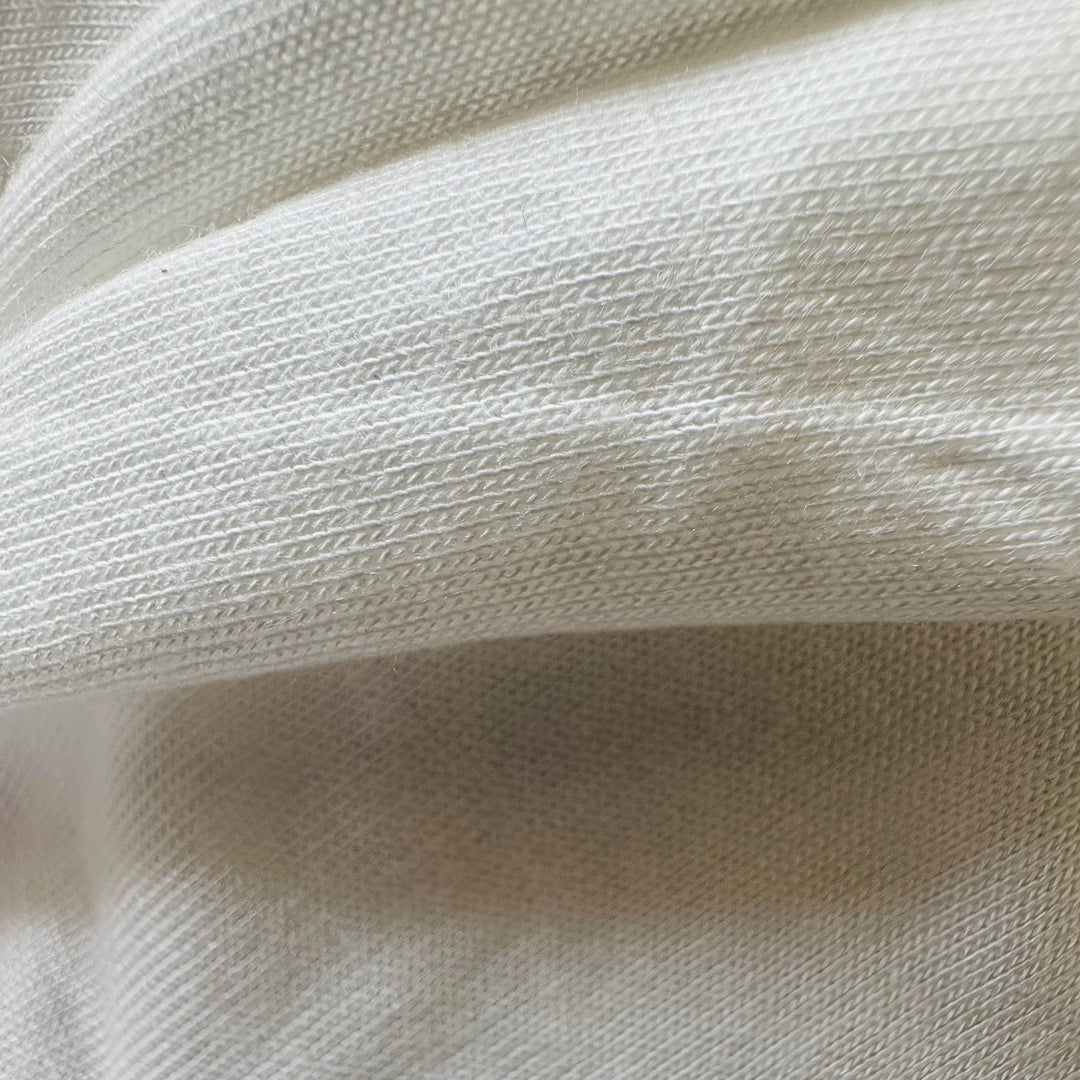 100% Banana Knitted Fabric used to make t-shirt, leggings, and a sports bra