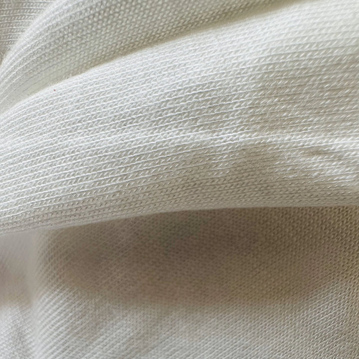 100% Banana Knitted Fabric used to make t-shirt, leggings, and a sports bra