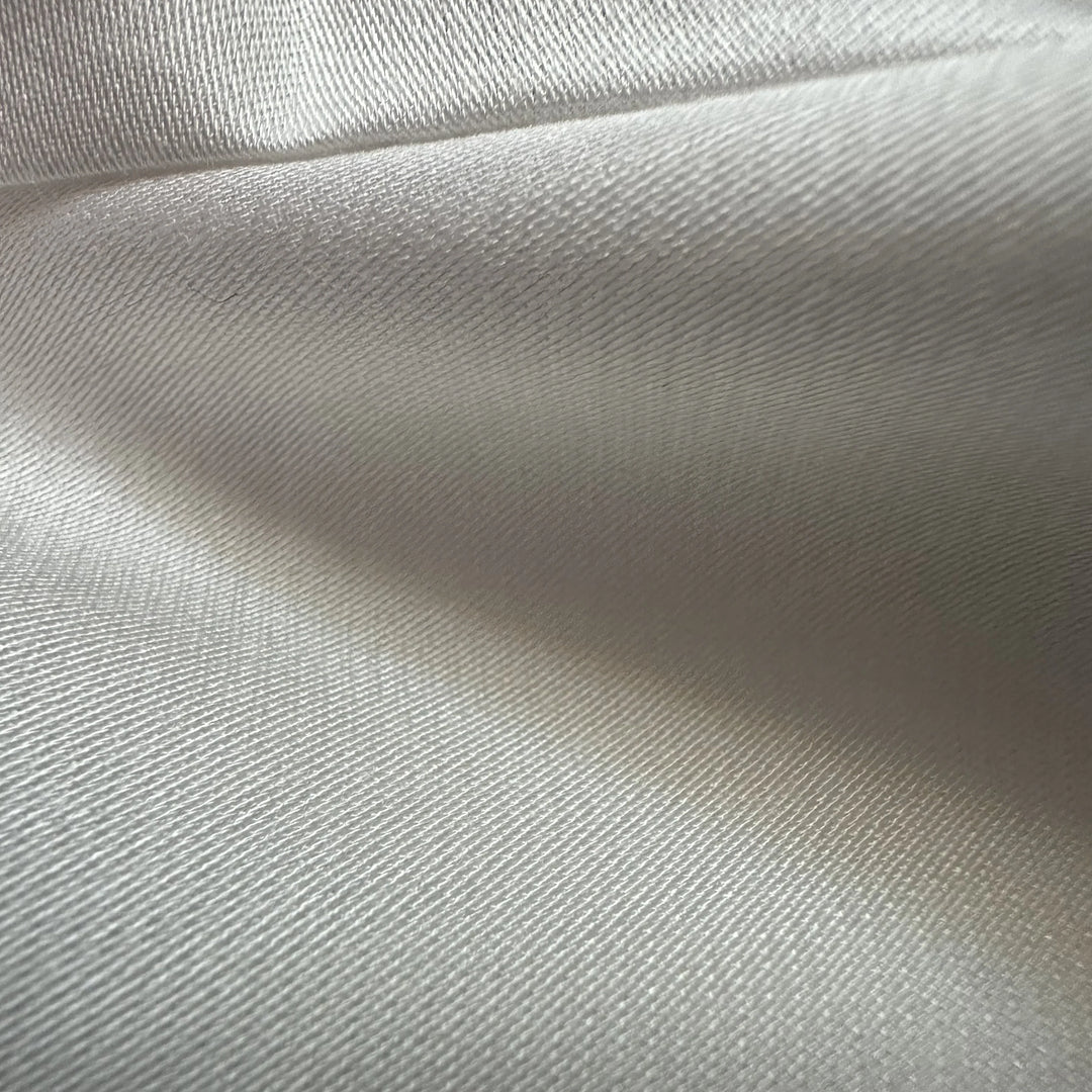 Eco-friendly bamboo satin fabric showing smooth drape and lightweight satin weave texture