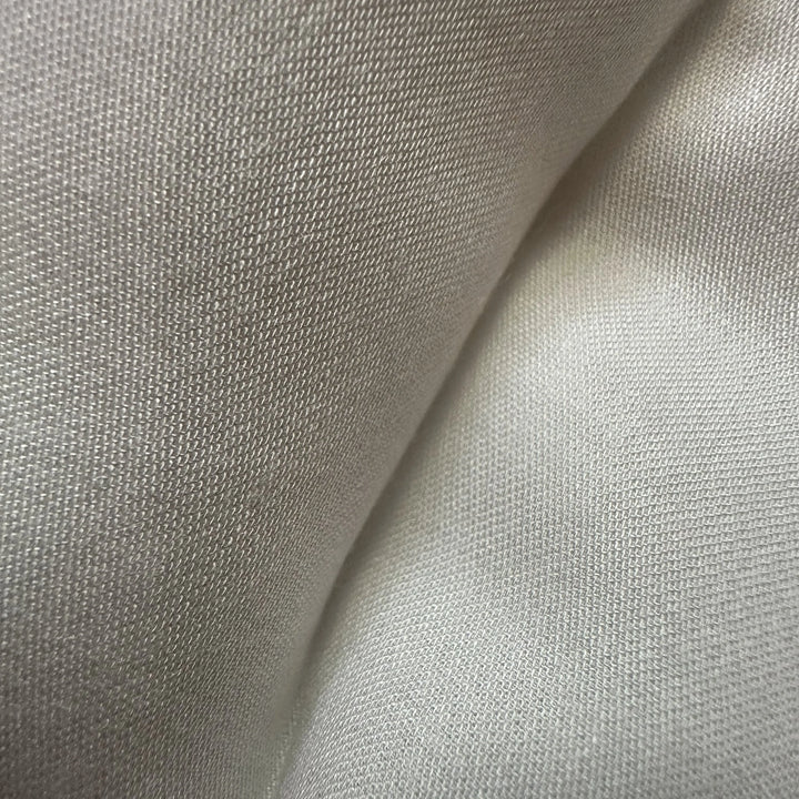 Organic bamboo satin fabric close-up highlighting lustrous finish and refined weave quality