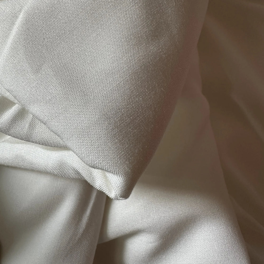 Eco friendly bamboo fabric blend showing smooth, lightweight drape, ideal for sustainable dresses and tops.