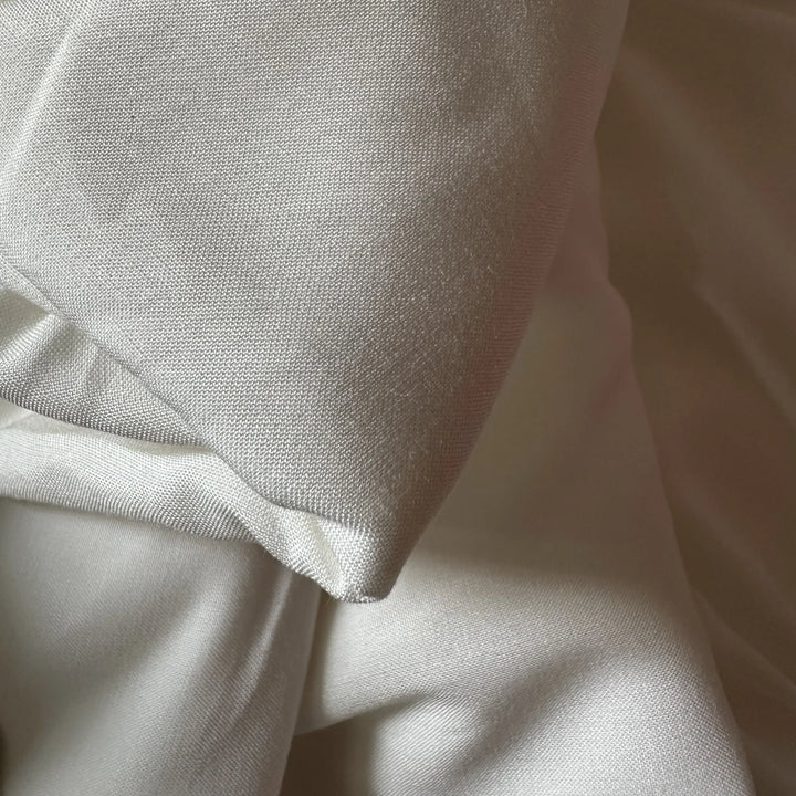 Eco friendly bamboo fabric blend showing smooth, lightweight drape, ideal for sustainable dresses and tops.