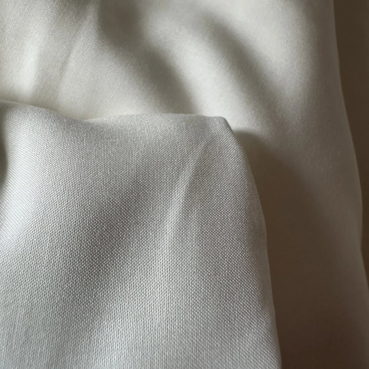 Lightweight, breathable bamboo lyocell blend fabric used in sustainable clothing, loungewear, and resort wear.
