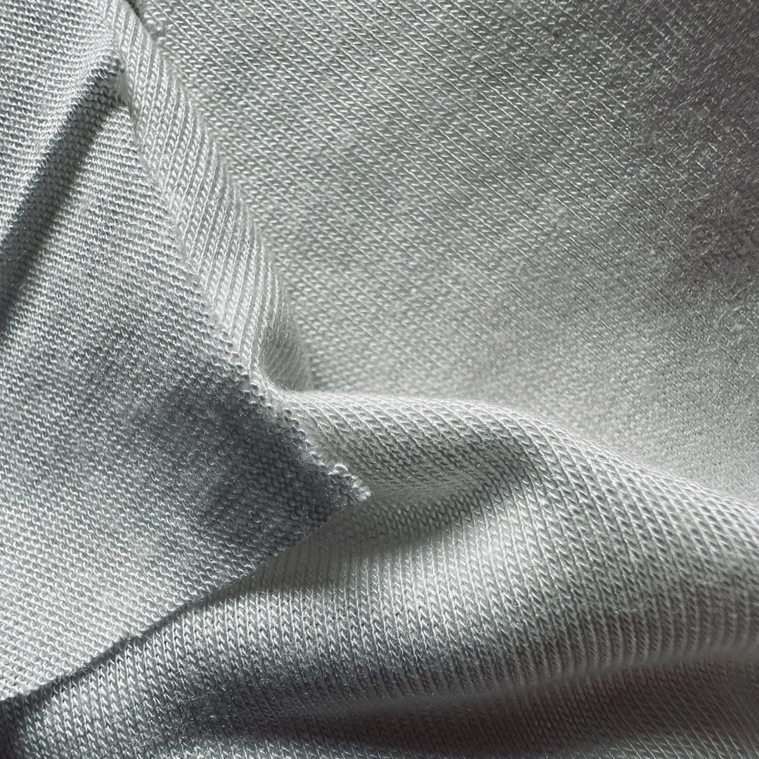 Close-up view of 100% Jasmine cellulose fabric highlighting fine knit construction and softness