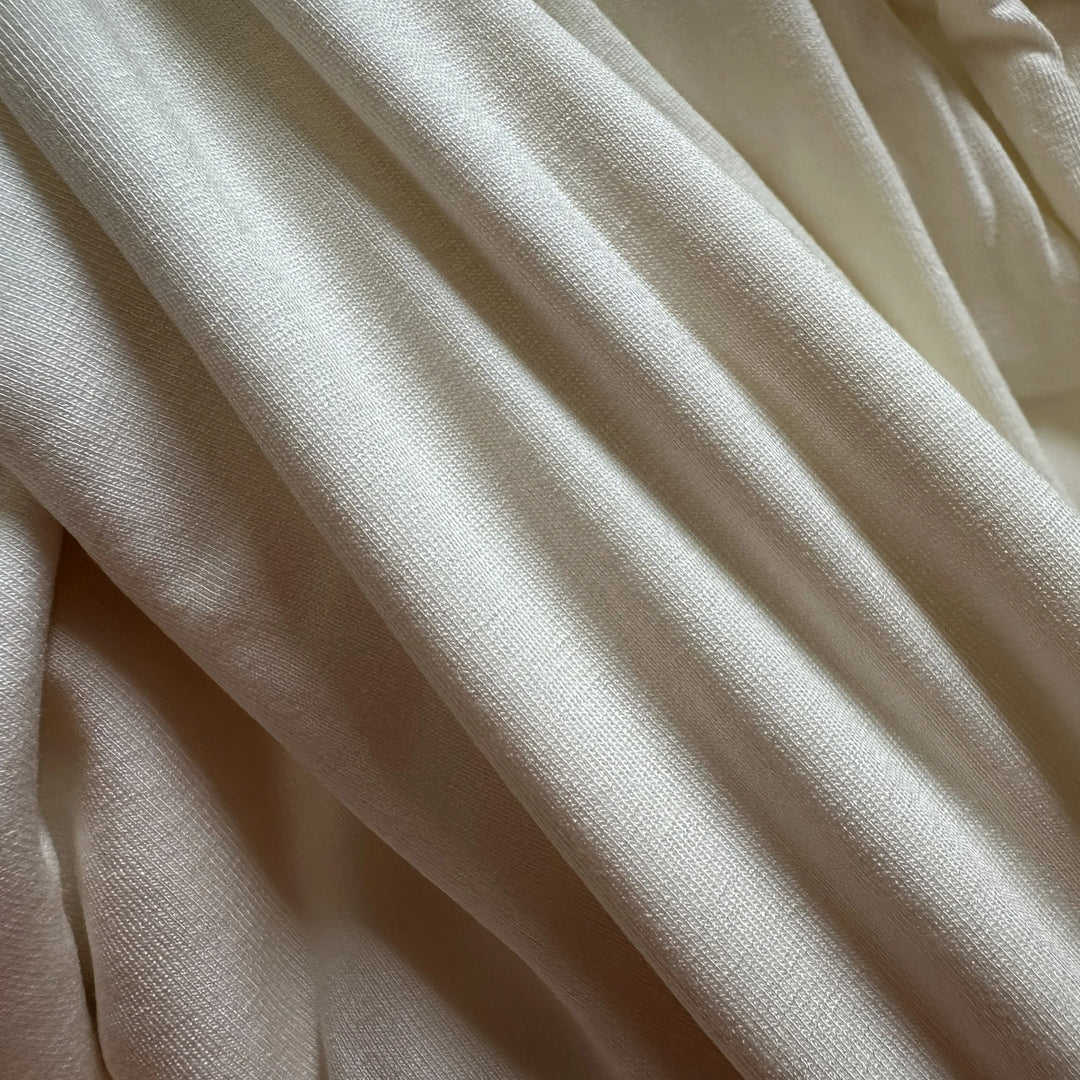 Plant-based Jasmine cellulose spandex knit fabric showing smooth surface and gentle elasticity