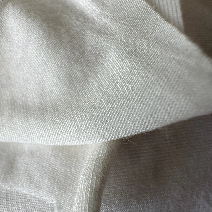 Close-up of Lotus Spandex Knitted Fabric with smooth texture and natural sustainability