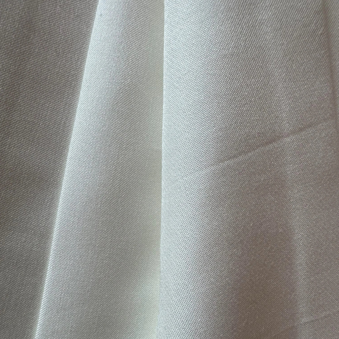Sustainable lotus fiber textile folded neatly, ideal for luxury eco fashion.