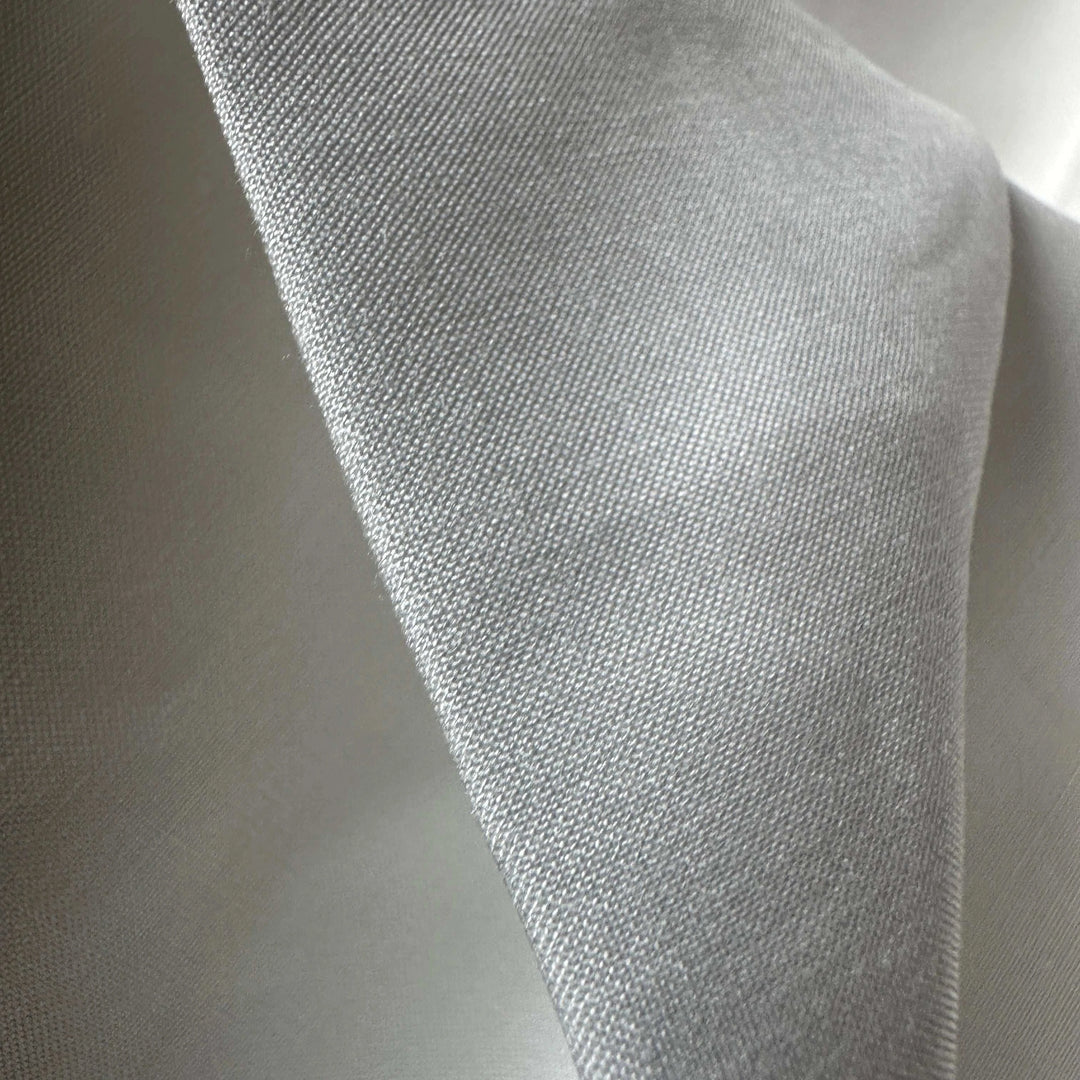 Sustainable lotus fiber textile folded neatly, ideal for luxury eco fashion.