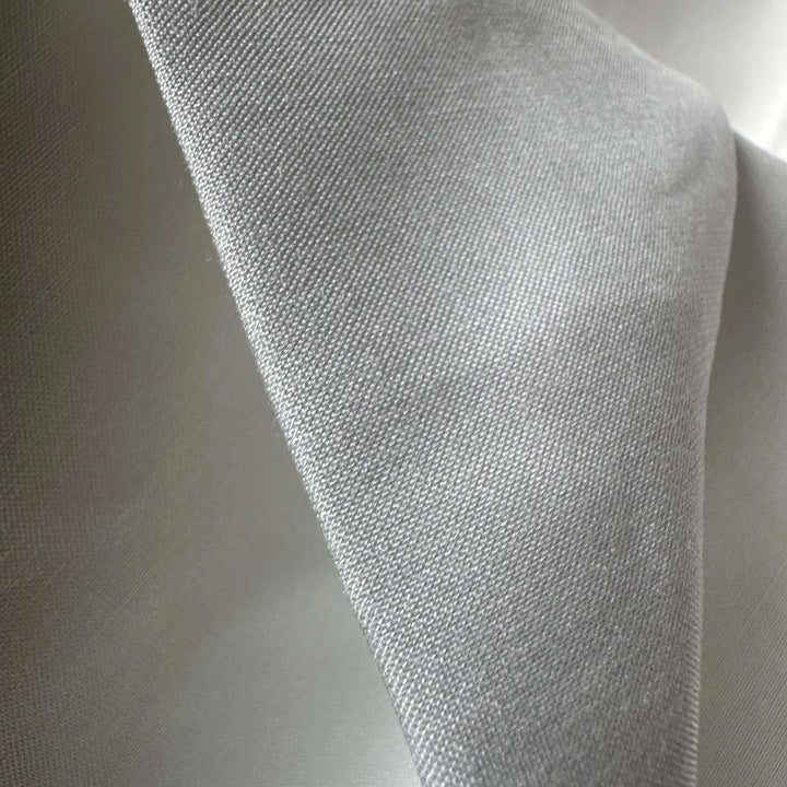 Sustainable lotus fiber textile folded neatly, ideal for luxury eco fashion.