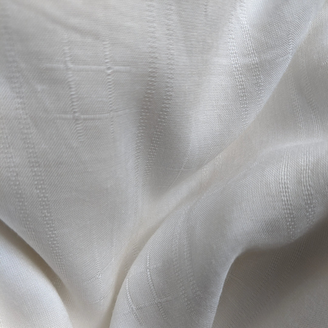 Detail shot of organic milk cellulose textile highlighting fine texture.