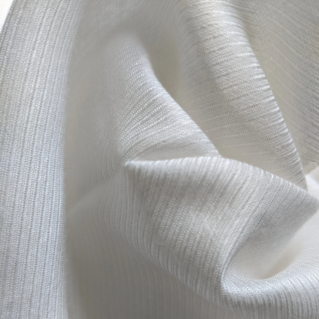 Eco-friendly milk fiber fabric draped elegantly to show natural flow and softness.