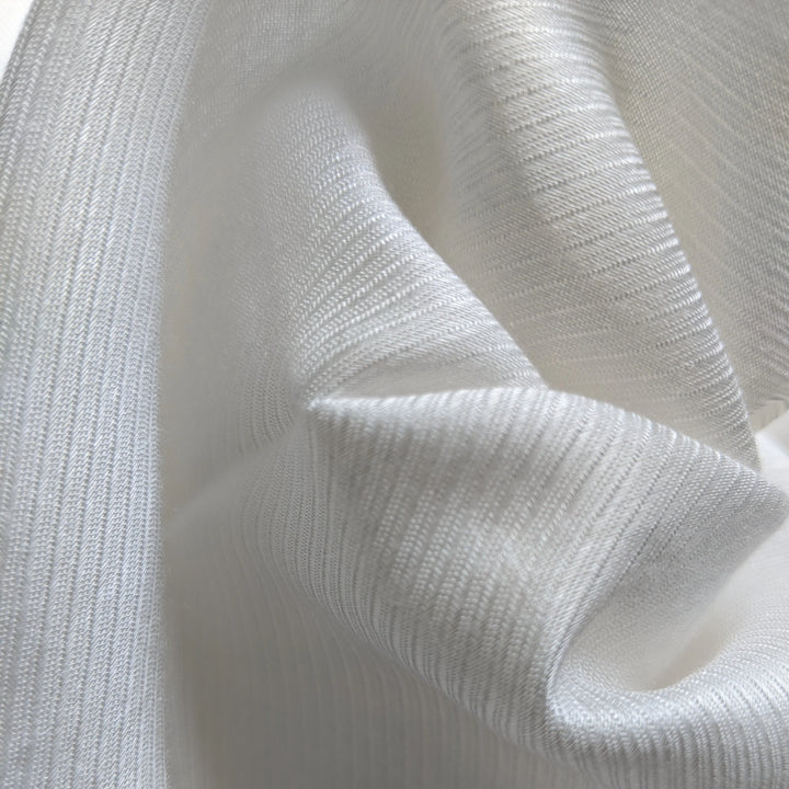 Eco-friendly milk fiber fabric draped elegantly to show natural flow and softness.