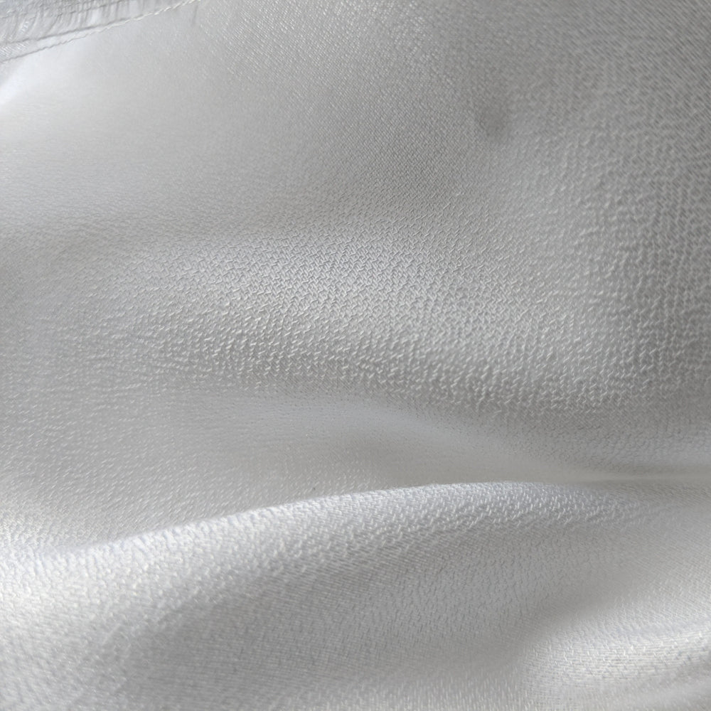 Milk-based cellulose fabric used in eco-conscious clothing production.