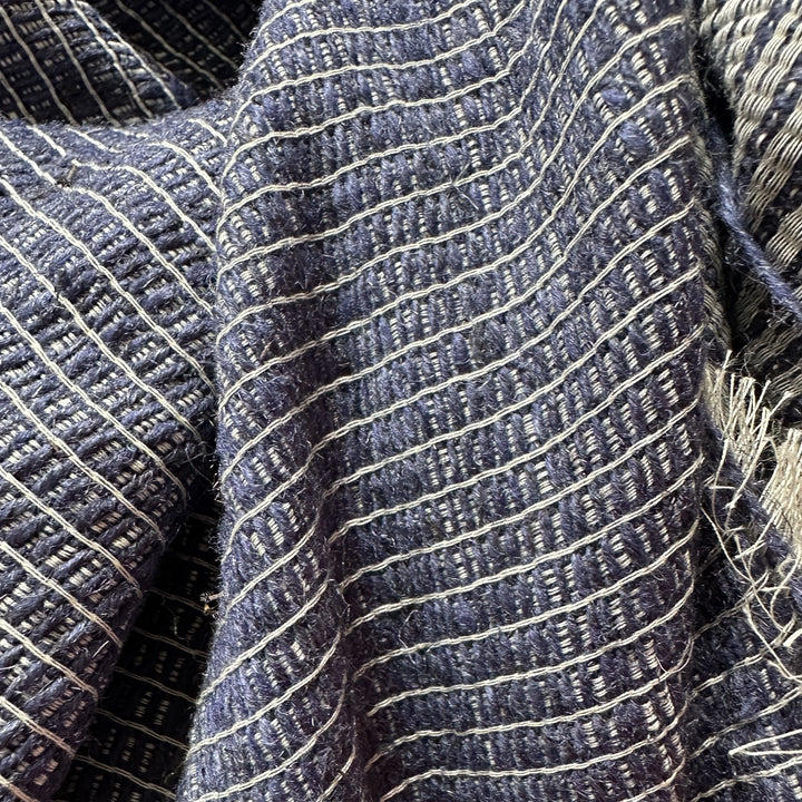 Textured view of eco-dyed Himalayan nettle fabric in natural yarn shades