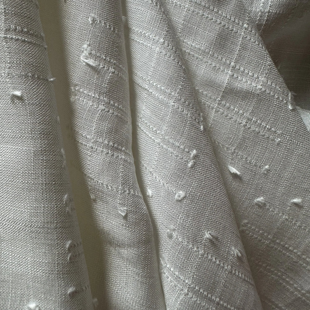 100% plant-based olive cellulose fabric with breathable structure and soft hand feel.