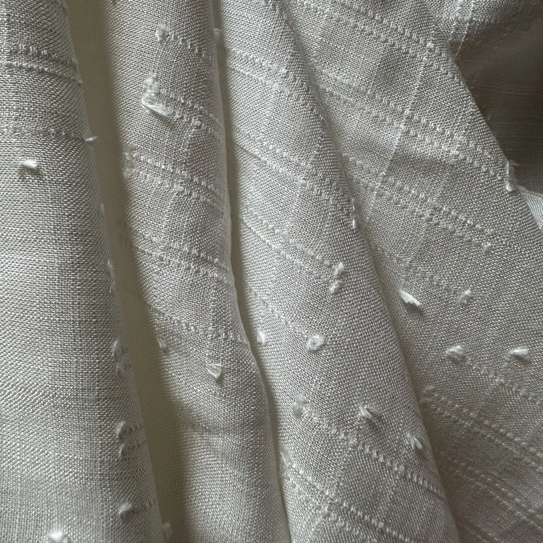 100% plant-based olive cellulose fabric with breathable structure and soft hand feel.