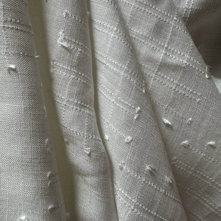 100% plant-based olive cellulose fabric with breathable structure and soft hand feel.