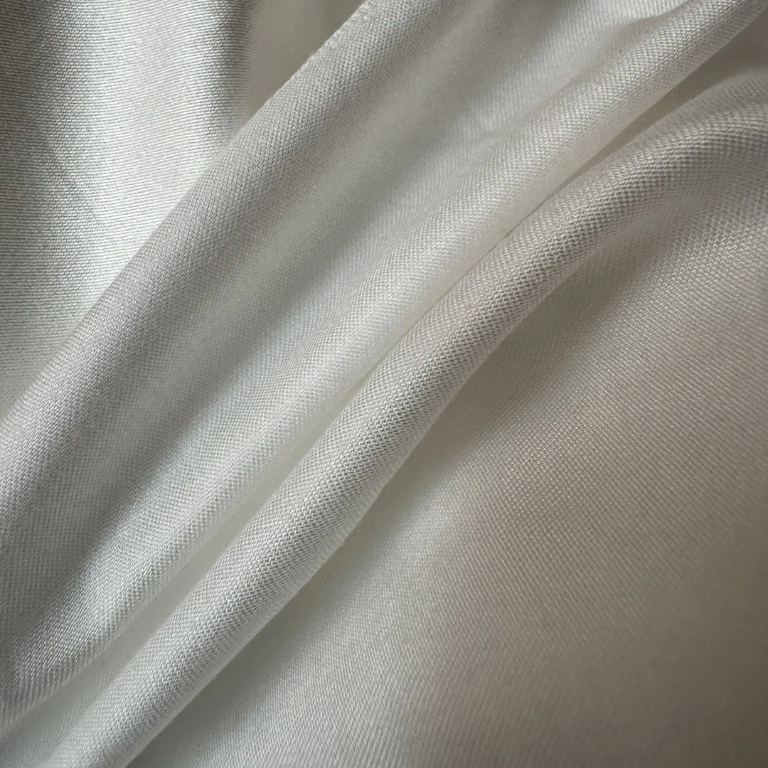 100% Pineapple Fiber Satin Fabric 130-135 GSM smooth plant-based textile close-up texture.