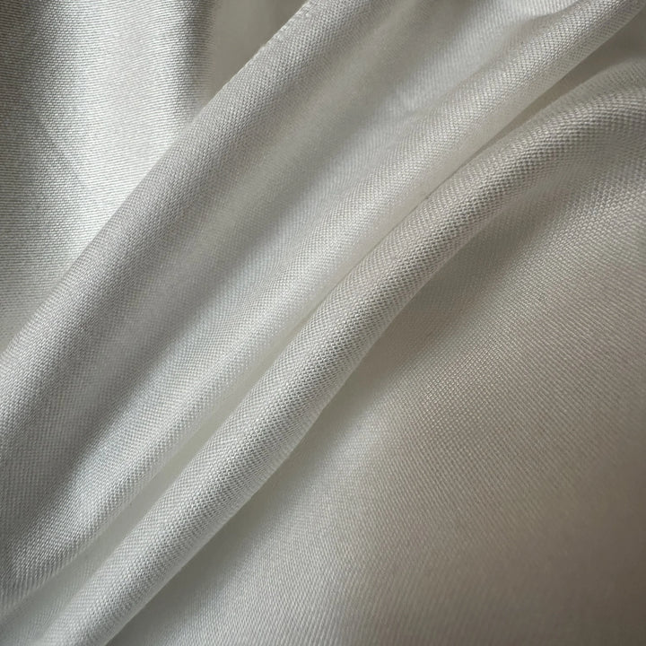100% Pineapple Fiber Satin Fabric 130-135 GSM smooth plant-based textile close-up texture.