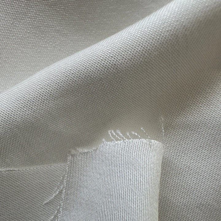 100% pineapple fiber satin fabric 110 GSM smooth surface with natural sheen plant-based textile close-up