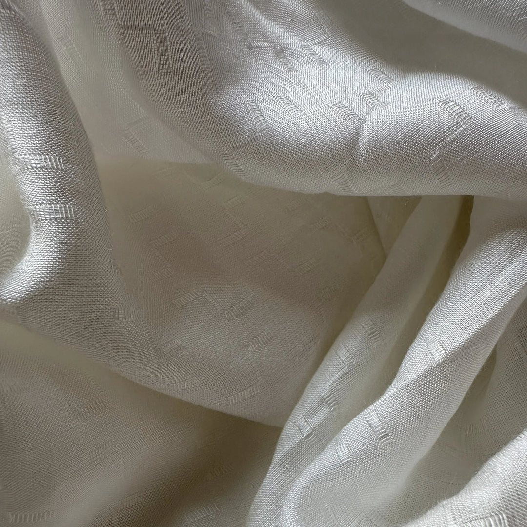 Eco-friendly rose petal fiber fabric with fluid movement, suitable for scarves, linings, and slow fashion garments