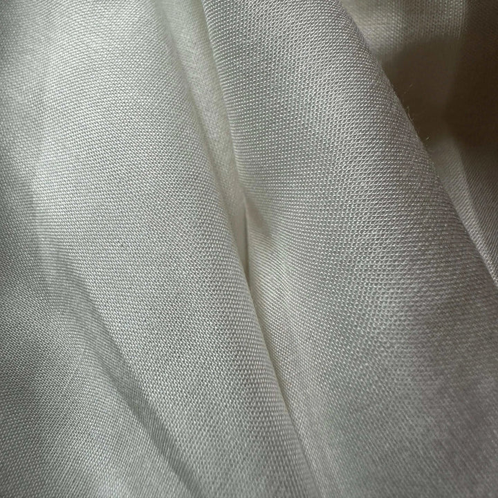 Organic rose petal fiber textile with elegant drape, ideal for minimalist and conscious luxury design