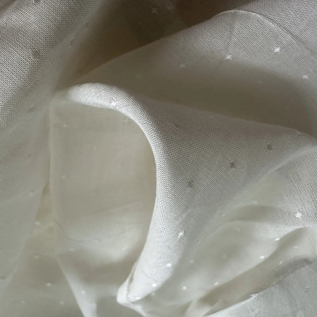 Ready-for-dyeing rose petal fiber fabric absorbing natural dyes evenly with a subtle, natural sheen