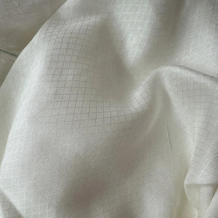 Close-up of sustainable rose petal fabric with smooth finish