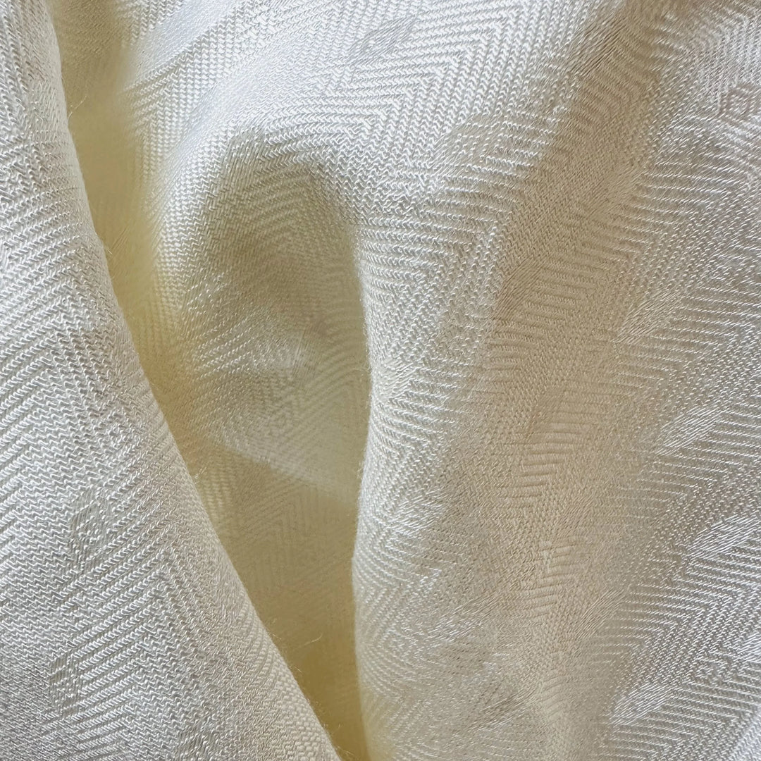 Hand touching organic sugarcane fabric to highlight softness and texture