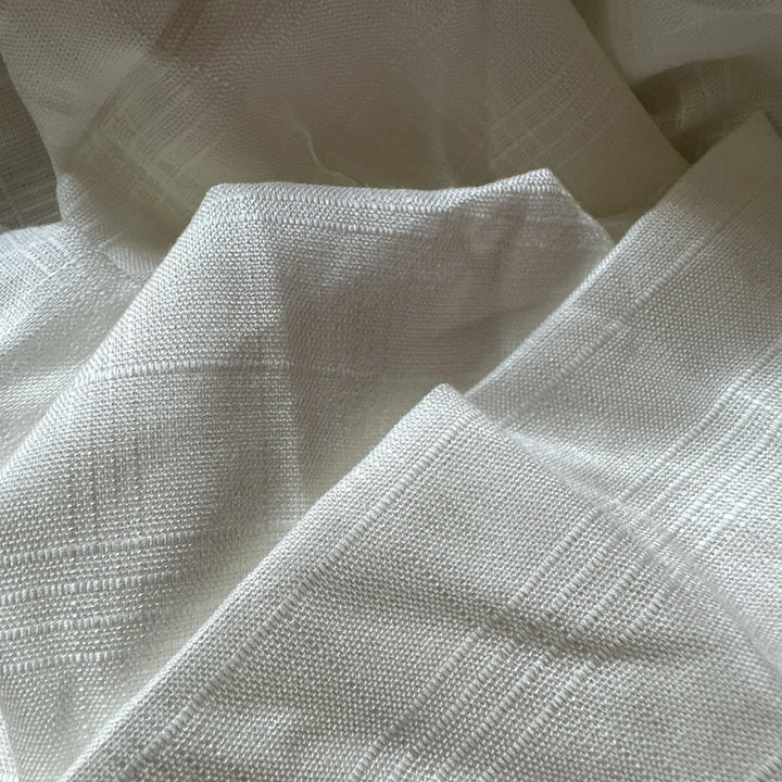 Side angle view of organic sugarcane fiber fabric showing soft drape and flow.