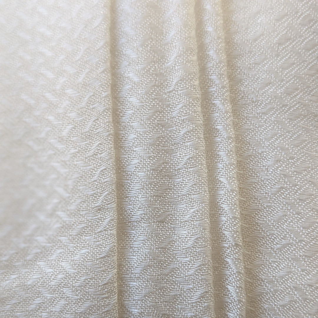 Sugarcane fabric swatches in various natural tones under sunlight