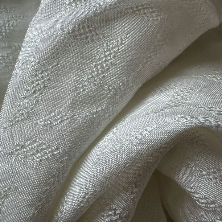 Close view of sugarcane fiber fabric highlighting lightweight eco textile quality.