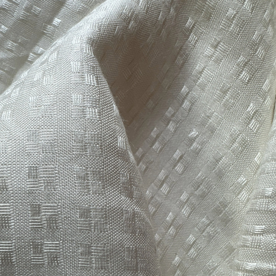 Organic sugarcane fiber fabric with natural drape and airy construction.