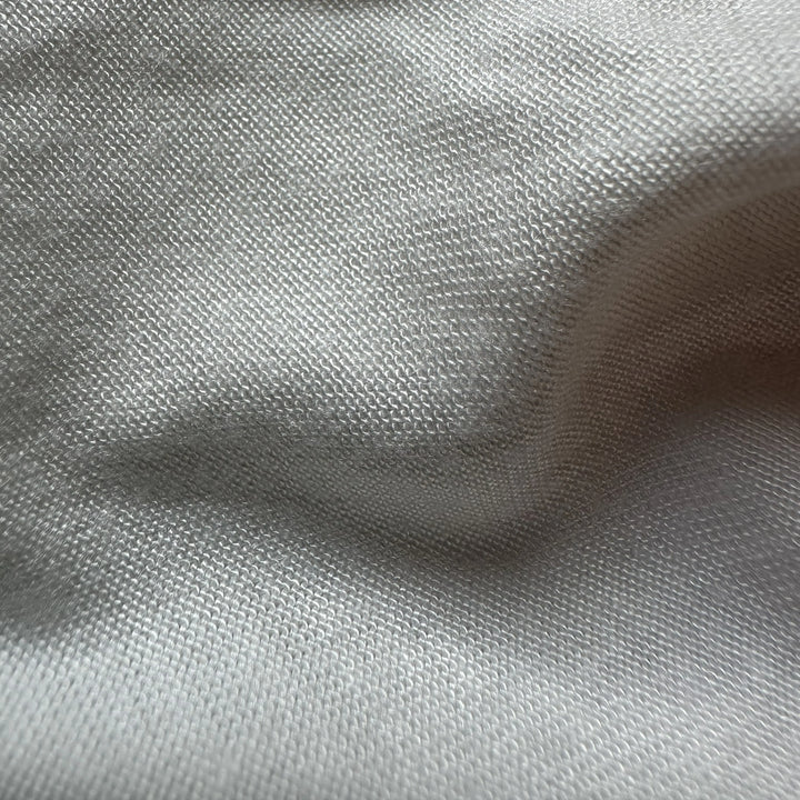 Close-up view of organic sugarcane fiber knit fabric highlighting smooth surface and drape