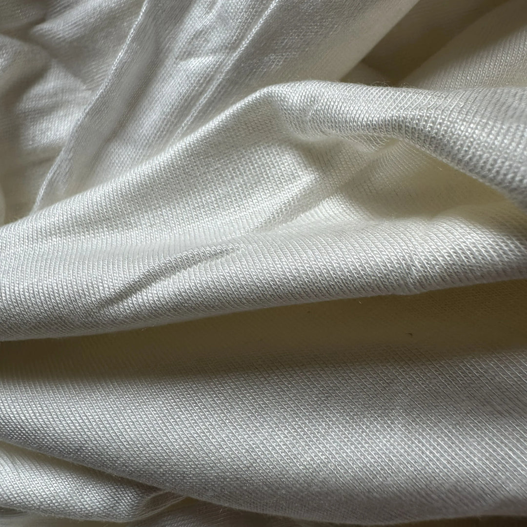 Close-up of 100% aloe vera single jersey knit fabric with soft hand feel and natural antibacterial benefits.