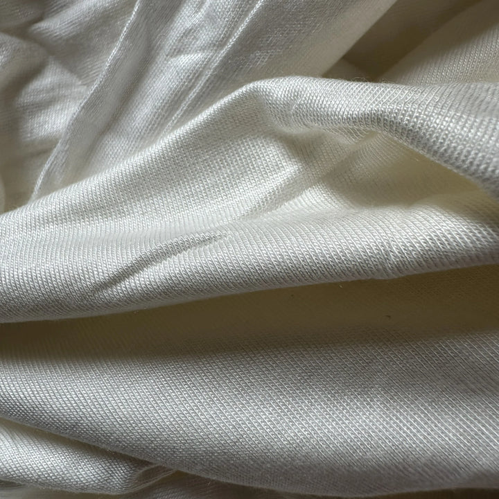 Close-up of 100% aloe vera single jersey knit fabric with soft hand feel and natural antibacterial benefits.