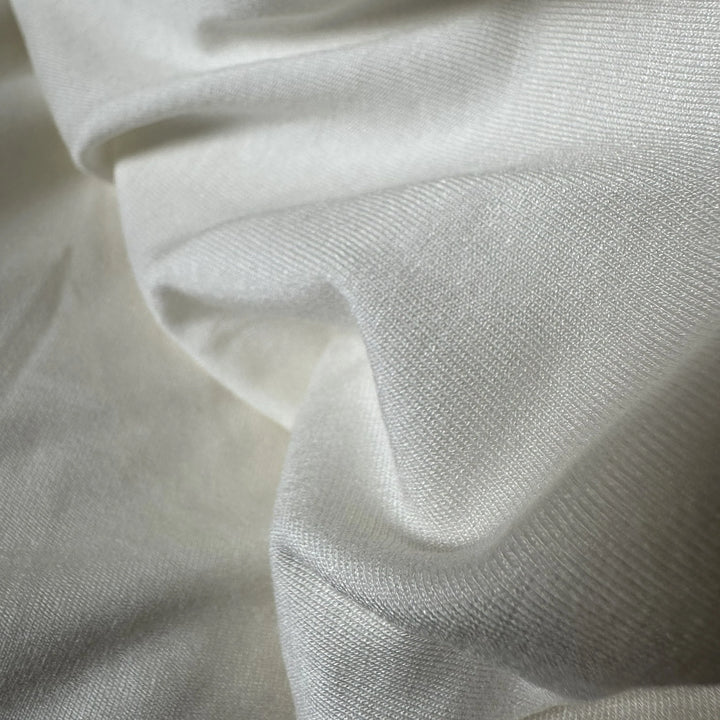 Biodegradable rose fiber fabric crafted for sustainable fashion and eco-luxury clothing.